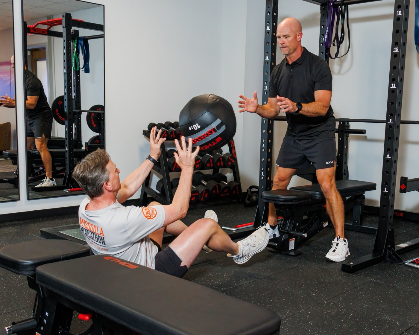 Coached med-ball core work at FINISH Performance Health